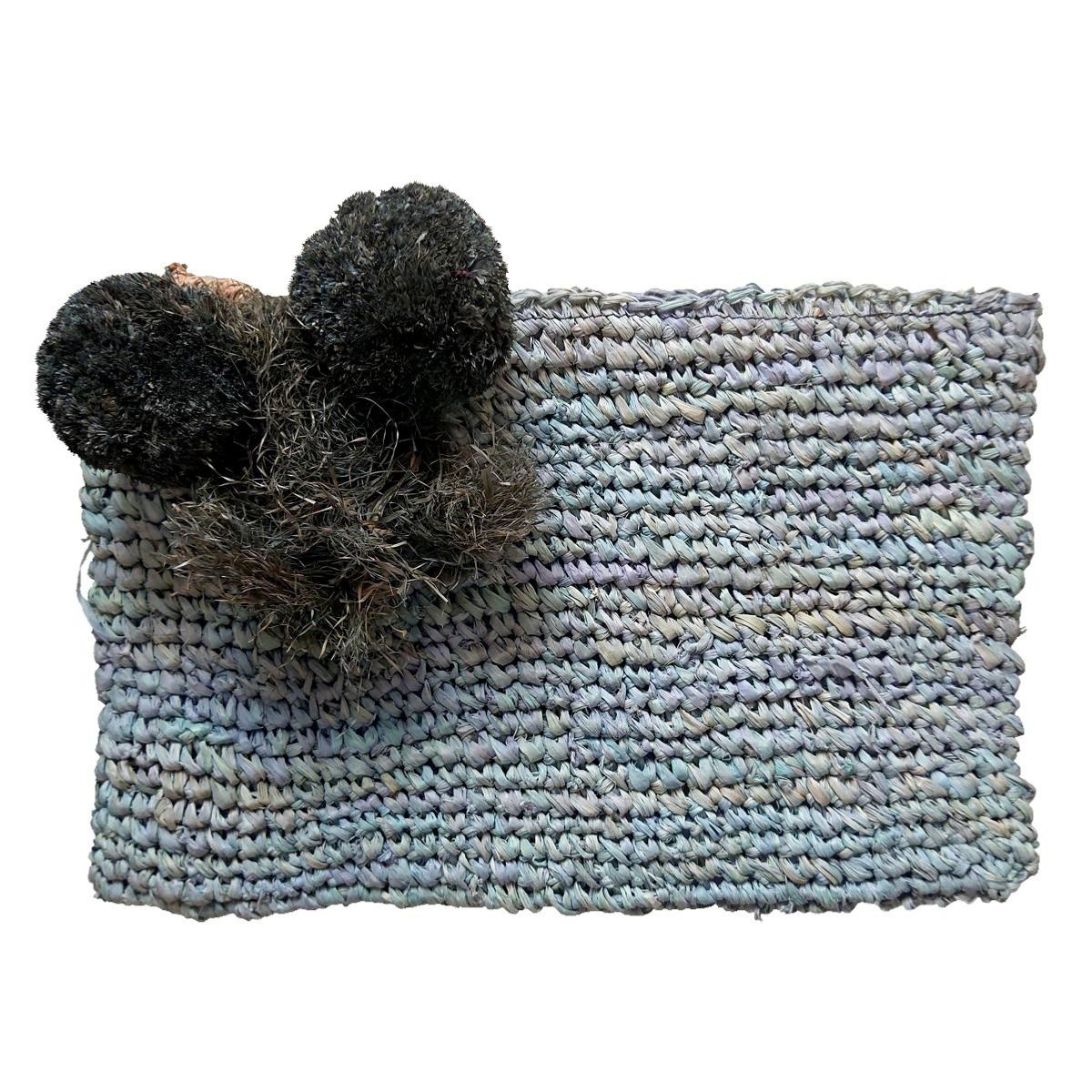 Bastbeutel mit Pompons